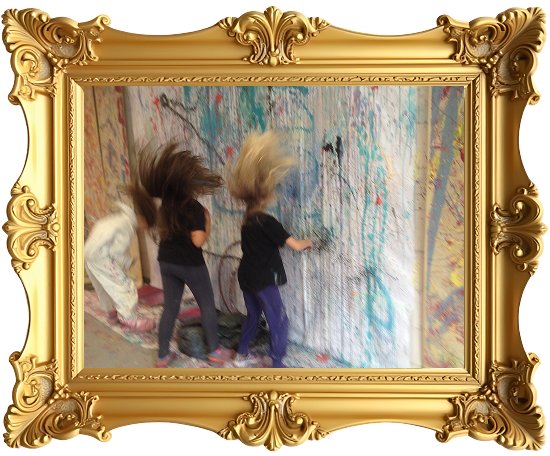 Three children with hair flipping mid-motion in front of a colorful, abstract painted wall inside a golden ornate frame.